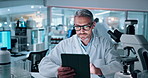 Man, scientist and typing on tablet in lab for research, medical report and experiment results. Mature person, digital and biotechnology with virus investigation, online study and feedback of vaccine