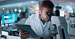 Microscope, science and tablet with man in lab for development of cure, medicine or treatment. Biotechnology, innovation and investigation with research scientist in clinical trial for breakthrough