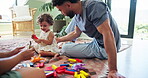 Parents, baby and playing with building blocks in home for creative imagination, child development and fantasy game. Love, people and bonding with kid on floor for motor skills, learning and support