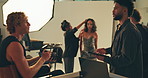 Photography, tablet and backstage with man in studio for fashion model, creative director and planning process. Magazine media, photoshoot and catalog project with people on set for behind the scenes