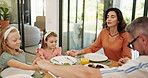 Children, praying and together with holding hands at lunch in house with food, bonding and faith. Parents, kids and gratitude with religion, love and connection with family at Easter in dining room