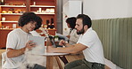 Business people, laptop and discussion with tablet in cafe, article information and teamwork. Coffee shop, research and men as journalists with digital, blog web and angle solution for press release