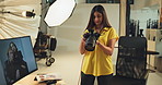 Photography, camera and review with woman in studio for production, creative director and editor. Photoshoot decision, branding campaign and backstage selection with person on set for catalog