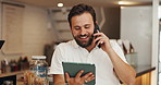 Phone call, man and owner with tablet in coffee shop for online order confirmation with supplier. Digital technology, restaurant and male hospitality professional on mobile discussion for inventory.