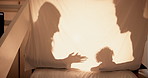 Tent, home and shadow with family, happiness and games with weekend break, love and kid. Parents, apartment and child in living room, toys and bonding together with mom, storytelling and dad