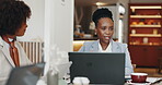Meeting, cafe and woman with laptop, talking and plan for project with tech, sales manager or serious. Corporate, employee and discussion for collaboration in restaurant, business and people with web