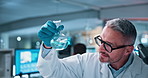 Laboratory, mature man and chemical with microscope testing for chemistry, study or medical research. Biotech, scientist and analysis with liquid inspection for pharmaceutical or pathology experiment