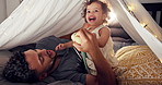 House, father and baby with fun, smile and bonding together  with happiness, laughing and games. Apartment, family and dad with parent, joyful and playing with books, humor and love with tent
