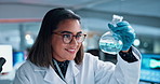 Scientist, woman and chemical in beaker with testing for chemistry, smile and medical research. Biotech, laboratory and analysis with liquid inspection for pharmaceutical or pathology experiment
