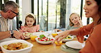 Parents, kids and dish food with help, plate and salad at lunch with bonding, talking and love at Easter. Mother, father and children with nutrition, health and diet with thanks for holiday in home