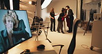 People, photographer and model photoshoot in backstage for casting results, editing and catalog. Photography, staff hug and retouch process to review picture, fashion production and magazine industry