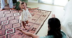 Home, walking and parents with baby, happiness and bonding together with embrace. Motor skills, mother and father with toddler, celebration or child development with growth, excited and learning