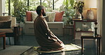 Islamic, religion and man with praying on mat in home for spiritual worship, meditation and muslim faith. Ramadan, person and salah in lounge for fasting tradition, mindfulness and praise to Allah