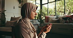 Fasting, prayer and Muslim woman in home for religion, worship and praise to Allah in living room. Religious faith, spiritual and Islamic person for Ramadan Kareem, salaah and praying for peace