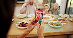 Phone screen, picture and food with family at dining table for memory, nutrition and bonding. Love, photography and lunch with group of people and mobile at home for meal, post and relax together