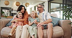 Parents, children and playful with hug on couch with care, love and bonding in living room at family home. People, mother and father with kids, girl and excited with game, embrace and happy in house