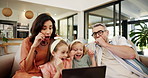 Family, shock and relax with laptop for movie, entertainment or online streaming on sofa at home. Mom, dad and children with surprise on computer for fright, scare or watching with parental guidance