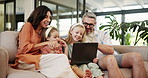 Happy family, relax and watching with laptop on sofa for entertainment or bonding together at home. Mom, dad and children or kids with smile on computer for fun movie, cartoon or online streaming