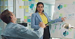 Designer, presentation and statistics with business people in office together for development or learning. Pointing, tablet and whiteboard graph with woman training man at work for upskill coaching