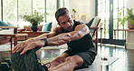 Stretching, man and exercise in home, fitness and training for wellness in morning, routine and living room. House, balance and person with workout for health, flexibility or performance in apartment