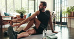 Home, man and thinking with stretching for fitness, physical activity and wellness with morning routine. House, male person and warm up with thoughts for exercise, workout and endurance in lounge