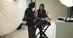 Happy, makeup artist and women on set, model and preparing for photoshoot, glow and cosmetics. Production, studio and makeover for girl with lipstick, behind the scenes and people with equipment