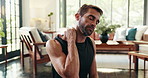 Shoulder pain, home and man with injury, fitness and accident in living room, exercise and hurt in apartment. Thinking, sprain and massage for bruise, workout and tension on muscle, swollen or house