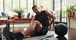 Active, man and back pain of exercise at home with medicine ball, fitness injury and workout break. Male person, massage and discomfort of muscle strain, spine accident and training mistake in lounge