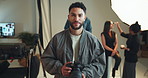 Camera, lighting, photography with face of man for fashion magazine or style photoshoot. Direction, production or smile with happy photographer behind the scenes for artistic or creative catalog