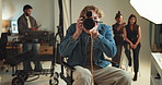 Camera, photograph and smile with man on set for fashion magazine or style photoshoot. Direction, happy or production with confident photographer behind the scenes for artistic or creative casting