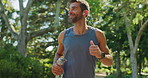 Fitness, running and thinking with man in park cardio, marathon training or sports exercise. Idea, smile or workout and happy athlete or runner outdoor in nature with water bottle for hydration 