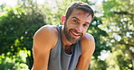 Break, runner and man with earphones, smile and workout for athlete in nature, outdoor or breathing. Exhausted, routine and person with music for exercise, fitness and practice for marathon or sports