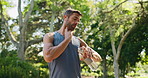 Outdoor, runner and man with smart watch for heart rate, check and practice in morning for fitness. Exercise, athlete and pulse tracker in nature, app and monitoring of performance, healthy and tech