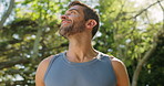 Happy, fitness and man on break, runner and removing earphones for natural sound, healthy and thinking. Outdoor, athlete and person with routine in morning, wellness or practice for marathon in woods