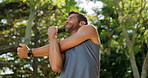 Training, outdoor and man with earphones, stretching and listening to music for fitness and smile. Routine, athlete and warm up for person in nature, performance or workout with playlist in morning