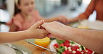 Children, praying and holding hands with family, food and closeup in house, bonding and faith. Parents, kids and gratitude with religion, love and connection with celebration at Easter in dining room