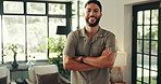 Face, home and man with arms crossed, smile and confidence with hospitality. Portrait, person and happy guy in living room, proud and hotel owner with accommodation, lodge and cheerful with joy