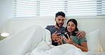 Home, bedroom and couple with smartphone, blanket or internet for social media, relax or app. Apartment, man or woman with blanket, cellphone or mobile user with subscription service or entertainment