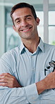 Healthcare, doctor and face of man for arms crossed, about us and professional career with happiness. Hospital, male cardiologist and portrait with confidence for medical help, treatment and pride