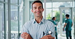 Face, doctor and happy man in hospital for wellness service, medicine or healthcare. Medical professional, confident cardiologist and portrait of worker, coworking or arms crossed for pride in clinic