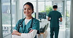 Face, confident nurse and happy woman in hospital for wellness service, medicine or healthcare. Medical professional, intern and portrait of employee, coworking or arms crossed for pride in clinic