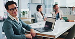 Face, laptop or happy business man in office, intern or finance at hedge fund for investment. Portrait, glasses or corporate professional worker coworking for opportunity or profit growth in meeting