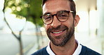 Businessman, face and outdoor with smile in city for commute, travel and confidence in road. Professional person, happy and glasses in portrait on urban sidewalk for career, job and excited in Italy