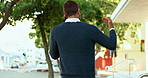 Business man, phone call and back in street for discussion, networking or contact for deal in city. Professional person, smartphone and mobile connection for conversation, listen or outdoor in France
