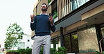 Business man, phone and celebration in street, deal and success on mobile app with low angle in city. Person, smartphone and win with fist pump, travel and cheers for goal on urban sidewalk in Italy