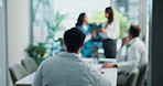 Hospital, teamwork and people in meeting, discussion or colleagues with documents in boardroom. Blurry, medical professional and collaboration with employees in clinic, talking or plan for healthcare