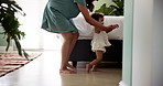 Home, first steps and mother with baby, walking and bonding together with child development. Motor skills, happy mama and learning with toddler, kid or support with growth, smile and balance