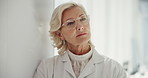Mature woman, glasses and thinking for optometry, vision or wellness for eyesight, health or choice of frame. Person, customer and check with decision for eye care, lens and style at retail shop