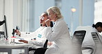 Women, computer and discussion in lab, team and review for progress, drugs and point at pharmaceutical company. People, science and feedback with study for medical research with vaccine development