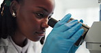 African woman, microscope and closeup with science at laboratory, studying and medical breakthrough. Person, tools and lens for zoom, bacteria and process for virus, vaccine and pharmaceutical drugs